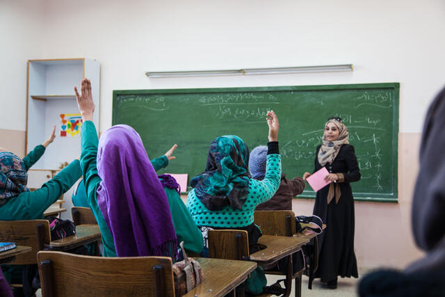 Women's Protection and Empowerment clients participate in an education session as part of the Hands Up for Syria project in Jordan. 