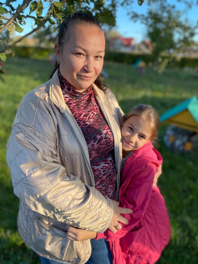 Mother Iryna hugs her daughter Safiya