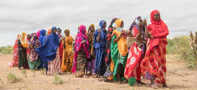 Women queue up for cash assistance after severe floods affected the Somali region of Ethiopia, destroying 99,000 hectares of farmland and killing 23000 livestock.