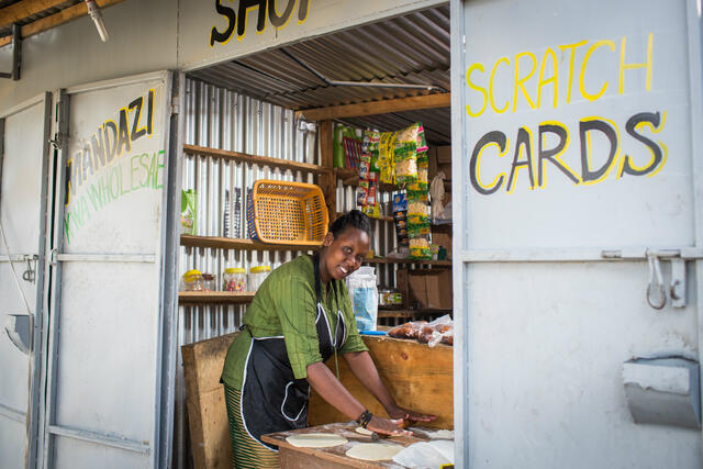 Chantal Rutonda Nyamuco prepares dough to make bread in her small mandazi stall in Nairobi.