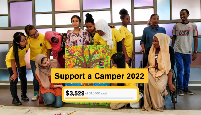 A diverse group of campers stand around and admire a painting of a tree they worked on. Placed over the image is a small graphic showing we have raised $3,529 of our $10,500 goal so far.