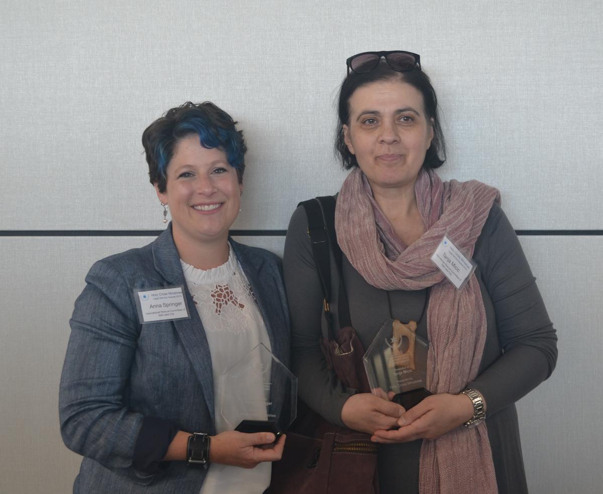 Tanja and Anna hold their Sister Kathleen Moroney Legal Service Awards presented by Holy Cross Ministries. Anna and Tanja, immigration specialists at the International Rescue Committee in Salt Lake City were presented an award for the immigration services they provide to refugees, asylees and other immigrants.