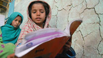 a girl reading in a book