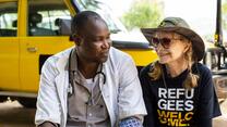 Mia ferrow sits next to an employee of IRC