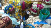 women exchange their food vouchers