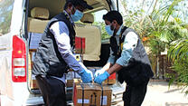 IRC staff unloads equipment as the IRC primary health care center in Cox's Bazar ramped up preparations for confronting the coronavirus pandemic.