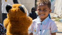 5-year old Yasser laughing at fox puppet