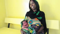 Kaltouma holds her baby in IRC health centre