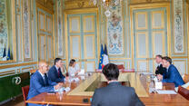 French President Macron with IRC CEO David Miliband and Europe Senior Vice-President Harlem Désir