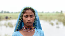 A young girl is seen in her culture attire during the flood emergency in Sindh, Pakistan