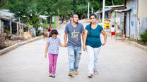 Andrea and her family, who left Venezuela, walk near their new home in Cucuta, Colombia.