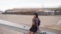 Image of Fernanda standing against a guard rail