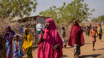 Somali refugee Zainab holds megaphone to raise awareness of women's rights
