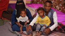 Yemeni couple Essam and Naziha with their 2 children inside a refugee camp