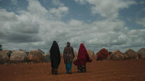 Women walk to their house, Torotorow IDP camp, Somalia.