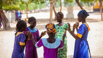 Oudjila, Cameroon. Wedé Clémautine, 12, Asta Julienne, 14 and some of their classmates having fun in the school playground.