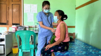 A medical staff of KBC is examining a patient at the Ziun clinic in Myitkyina in Kachin State