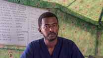 A man poses for a photo inside a building in Sudan.