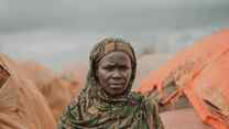 A woman poses for a photo outside in Somalia.