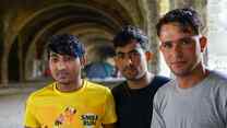 Three young asylum seekers sleeping rough in an abandoned building, Trieste, Italy