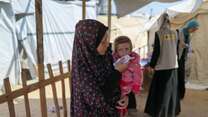 A child receives treatment for malnutrition in Shams Camp, Gaza