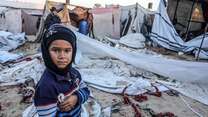 A child in front of tents in the Gaza Strip. 