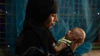 Samira with her newborn baby. 