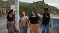 Jahel, an IRC Sr. Officer, takes a walk with Yari, Yessica, and Amarlisis, a staff member from the IRC’s local partner, Centro de Desarollo y Autogestión (DYA), near the family’s home.