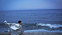 Boy in Greece after being rescued 