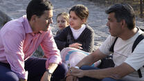 IRC president David Miliband speaks with refugees in Greece