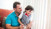 Hamzah with his son Abdullah in their home in California 