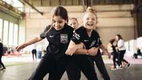Girls playing football