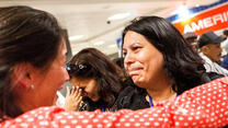 IRC staffer Kristin welcomes Shaista Sadiq at Dulles airport with a hug