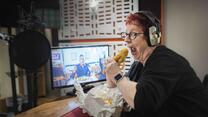 Joe brand eating fish and chips in the recording studio