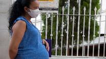 Pregnant woman wearing a face mask