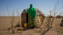 Sada Mohammed, stands in front of her temporary shelter near a remote village in the drought-affected Somali region of Ethiopia.