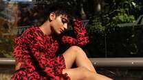  Najib Faizi dressed in a red dress 