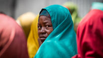 A drought displaced woman waits to see medical staff at an IRC operated clinic in KM8 IDP camp on the outskirts of Mogadishu, Somalia.