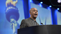 Tefere Gebre speaks at a podium at an AFL-CIO event