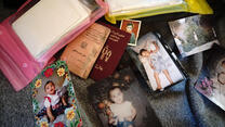 refugees' passports and family photos