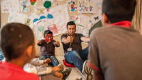 Syrian refugee boys in Beirut play at IRC play space