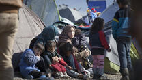 A refugee family find temporary shelter in a camp in Greece. Photo taken by Jodi Hilton for the IRC.
