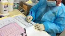 An IRC staff member in Jordan looks over paperwork. 