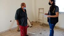 Assad speks with an IRC assessment team member in his Beirut home