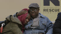 Sudanese father hugs his daughter 