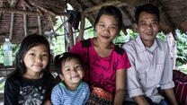 Bar Mee, her husband Tin Win, and their two daughters at Mae La refugee camp on the Thailand-Myanmar border.