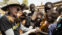 Mia Farrow with families in a village in in South Sudan with charity IRC