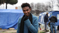 A young migrant in a makeshift settlement in Italy.