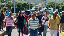 Venezuelans cross the Simon Bolivar Bridge into Colombia on foot