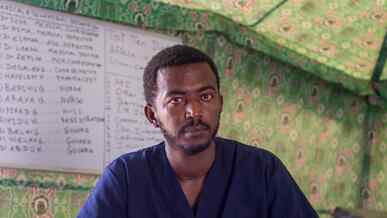 A man poses for a photo inside a building in Sudan.